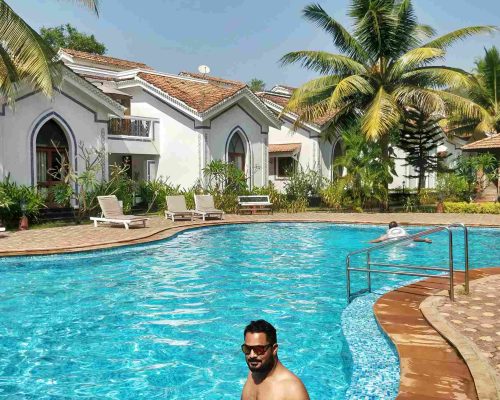beach resort with man in pool_2_11zon Hotels in Tarkarli