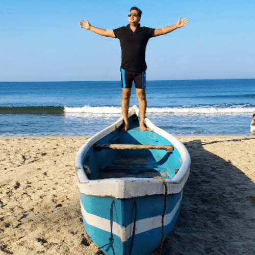 man on tarkarli beach